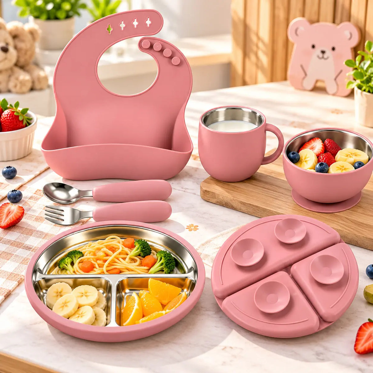 6-piece stainless steel baby feeding set with divided plate, bowl, cup, bib, spoon and fork.